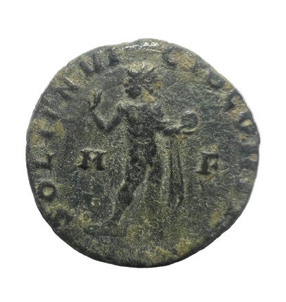Ancient coin with inscriptions on a white background